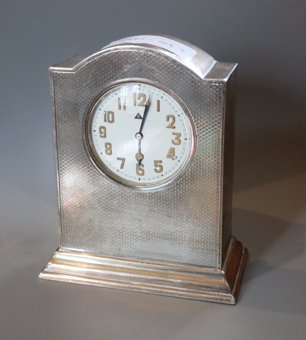 A George V engine turned silver mantel timepiece, W.G. Sothers Ltd, Birmingham, 1921, height 14cm.